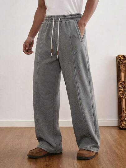 Quần dài nam kiểu Mỹ tối giản, màu xám đậm kẻ caro, dáng rộng, ống suông, có dây rút, kiểu dáng thường ngày.