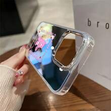 Funda para teléfono con espejo de los Osos Cariñositos, un alegre jugador de tenis. También funciona como espejo y es compatible con  17,  16 Pro Max,  15 Pro Max,  13 y  12. Fabricada en TPU resistente para mayor protección contra golpes y caídas. Regalo perfecto para familiares, amigos, celebraciones navideñas, parejas y ocasiones especiales como Navidad, citas o cumpleaños. - Plateado - Ver 4