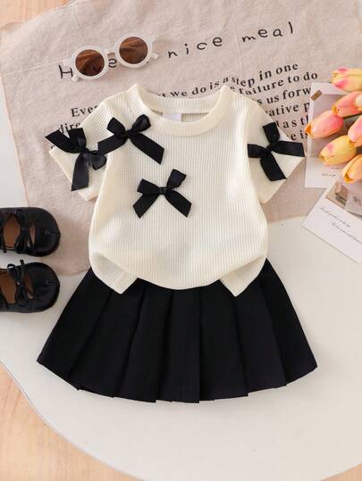 Baby Girl Casual Fashion Waffle Texture Black 3D Bow Decor Round Neck Short Sleeve Apricot T-Shirt And Black Pleated Mini Skirt Set