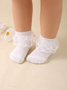 12/6/1 双随机颜色女婴蕾丝舞蹈袜，采用独特的时尚双层蕾丝设计，适合 0-36 个月的女婴参加派对和作为礼物穿着。这些可爱的袜子采用透气网眼面料制成，柔软舒适，可搭配各种服装和裙子，是完美的 情人节礼物。 - 彩色 - 查看 2