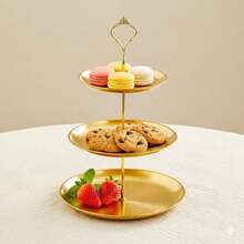 This Gold/Silver Three-Tiered Metal Dessert Stand Is An Elegant European-Style Display Stand For Cakes And Pastries. Ideal For Afternoon Tea, Wedding Decorations, And Other Occasions, It's Primarily Used To Showcase Desserts And Pastries. Cakes, Macarons, Cookies, And Other Treats Can Be Easily Placed On The Stand For Guests To Enjoy, While Also Serving As A Decorative Display. It Can Also Be Used As Table Decoration In High-End Restaurants. - Vàng - Xem 3