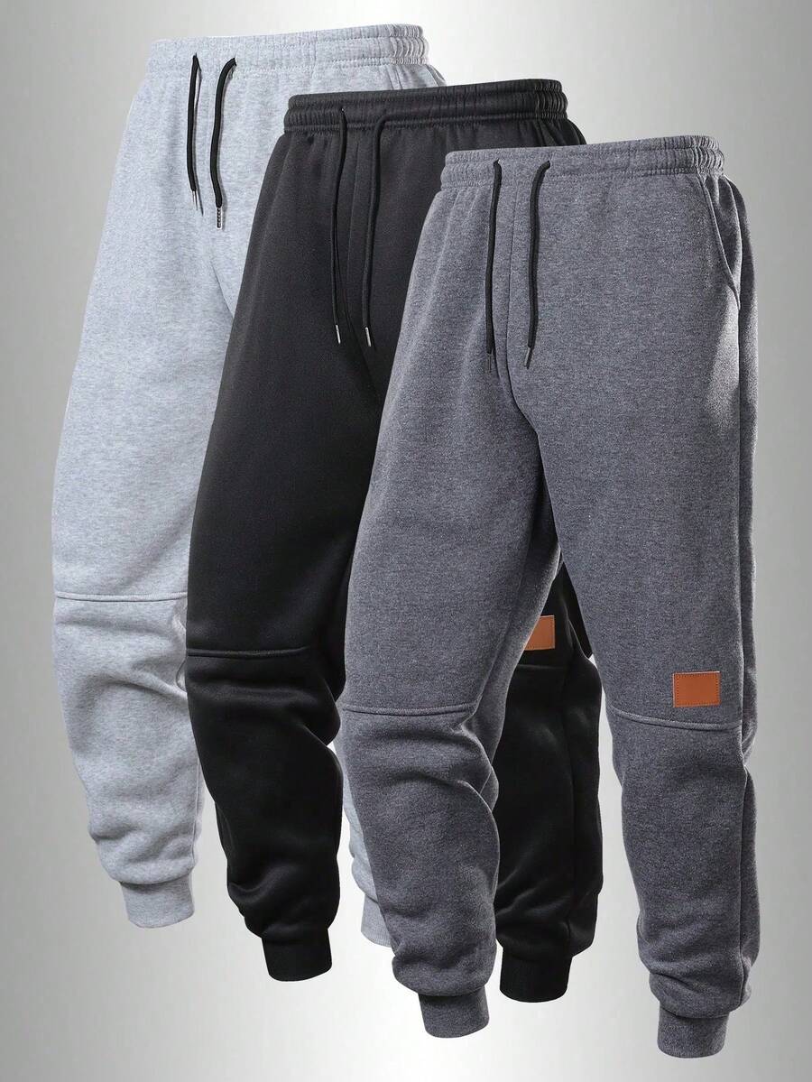 Pantalones deportivos para hombre para todas las estaciones, con cordón ajustable, bolsillos laterales y diseño de logotipo de parche, adecuados para gimnasio y correr - Gris Oscuro - Ver 1