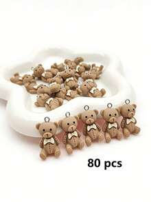 20/100/150/200 piezas Colgante de oso de peluche de resina plana marrón con lazo, lindos encantos de oso sentado para hacer joyas DIY, aretes, collares, pulseras, llaveros - Marrón - Ver 16