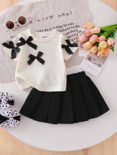 Baby Girl Casual Fashion Waffle Texture Black 3D Bow Decor Round Neck Short Sleeve Apricot T-Shirt And Black Pleated Mini Skirt Set