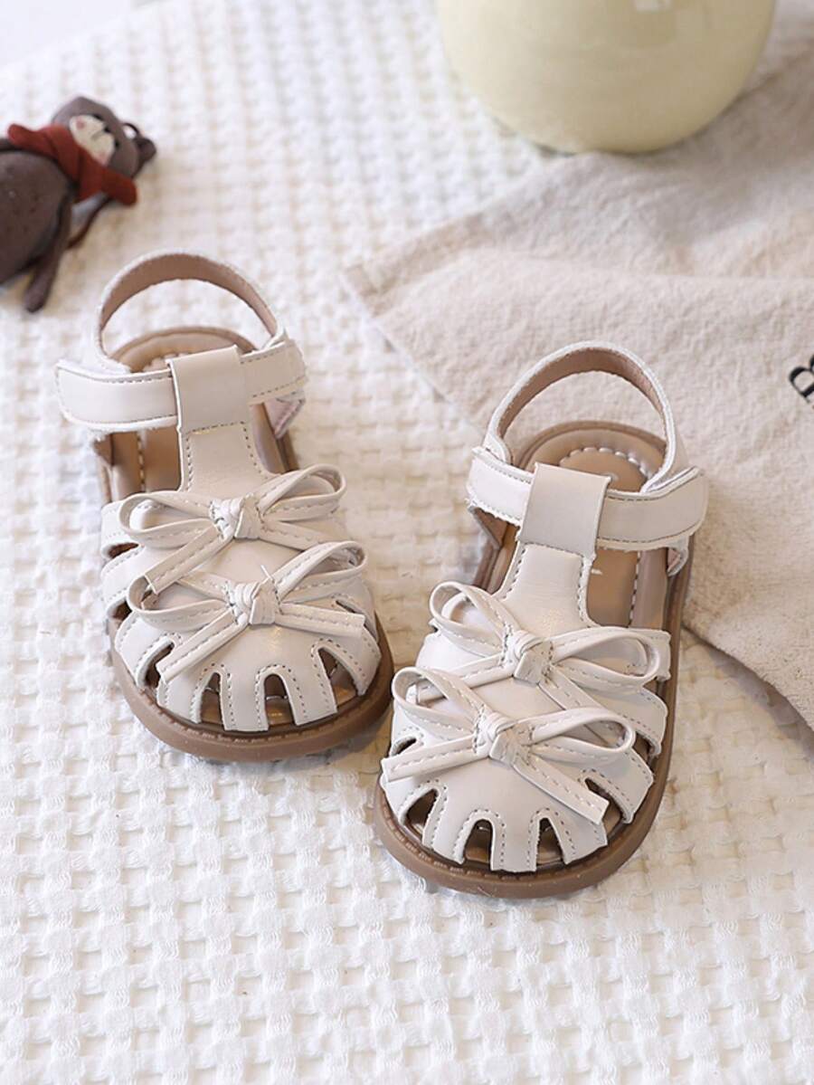 1双女童平底凉鞋，2026新款蝴蝶结包头时尚女童凉鞋，适合日常、上学、跑步、海滩等场合。 - 米色 - 查看 1