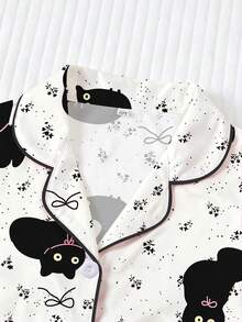 Conjunto de pijama casual para niña preadolescente, suave y amigable con la piel, con estampado lindo de gato negro, nuevo estilo infantil con top de manga corta y cuello tipo solapa, y shorts de cintura elástica holgada con dobladillo con volantes, estampado integral de gatitos negros y lazos, adecuado para uso diario de niñas preadolescentes y adolescentes - Blanco - Ver 4