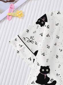 Conjunto de pijama casual para niña preadolescente, suave y amigable con la piel, con estampado lindo de gato negro, nuevo estilo infantil con top de manga corta y cuello tipo solapa, y shorts de cintura elástica holgada con dobladillo con volantes, estampado integral de gatitos negros y lazos, adecuado para uso diario de niñas preadolescentes y adolescentes - Blanco - Ver 7