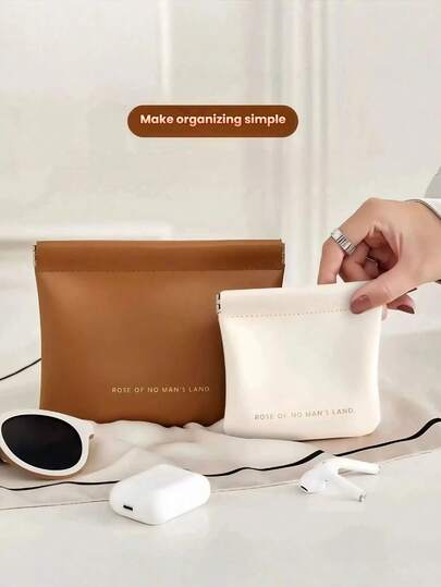 1个纯色多功能PU皮革收纳袋，男女通用设计，可收纳数据线、眼镜、耳机、口红、现金、珠宝和其他小物件，适合日常生活、户外旅行和收纳。