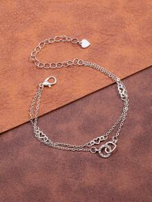 Un brazalete con forma de corazón entrelazado con diamantes de moda y un brazalete elegante - forma de corazón - Ver 1
