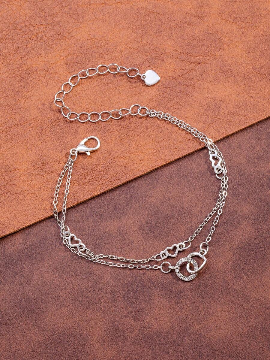 Un brazalete con forma de corazón entrelazado con diamantes de moda y un brazalete elegante - forma de corazón - Ver 1