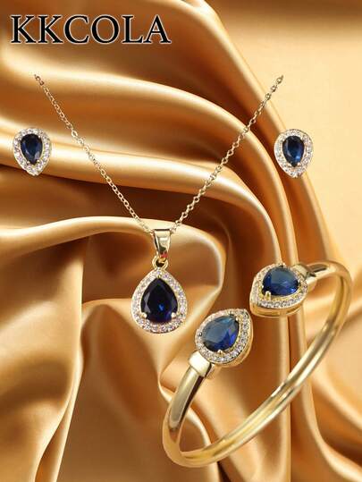 KKCOLA Bộ 4 món trang sức thời trang màu xanh dương hình giọt nước đính đá Zirconia, gồm dây chuyền, bông tai và vòng tay, phụ kiện bằng thép không gỉ, hộp quà tặng lý tưởng cho sinh nhật, Ngày của Mẹ, tiệc tùng hoặc đeo hàng ngày.