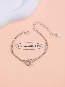 Un brazalete con forma de corazón entrelazado con diamantes de moda y un brazalete elegante - forma de corazón - Ver 4