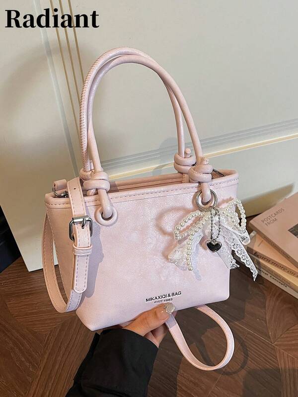 This Sweet And Gentle Basket-Style Bucket Bag Is A Stylish, Versatile, And Simple Women's Handbag. It Features A Pearl, Lace, And Bow Embellishment, A Zipper Closure, And An Adjustable Crossbody Strap. It Can Hold A Phone, Lipstick, And Other Small Items, Making It Suitable For Commuting, Dates, Shopping, Outings, Or As A Small Gift.