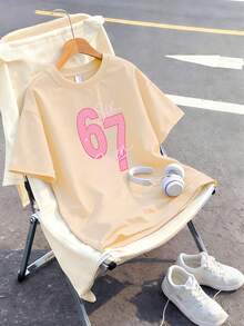 This Girls' Short Sleeve T-Shirt Features A Unique 67 Letter Print Design And A Soft Round Neck Design, Making It A Casual Apricot T-Shirt. - Apricot - View 2