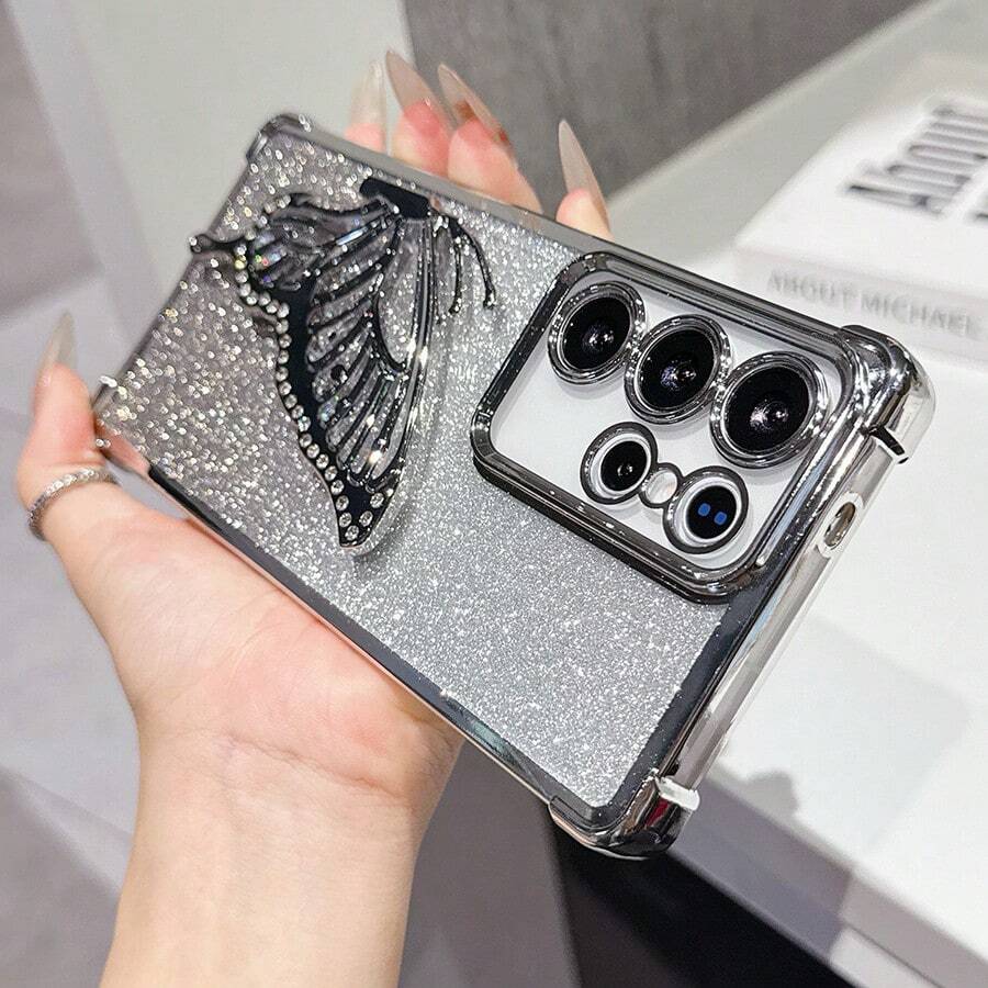 Shockproof, Transparent, Fashionable Electroplated Cushion Glitter Butterfly Stand Phone Case For Samsung Galaxy S26/S22/23/24/25/S24 FE/S25 EDGE, A04/05/06/A07/A14/A15/A16/A17/A24/A25/A34, Note 9/10/11/12/13, 9/10/12/13C 14C, MOTO, Honor X, HW, RENO C53 C55 C61 C63 C75,International Version, Not The Domestic Version - Silver - View 1