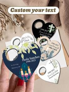 Abrebotellas personalizado en forma de corazón para bautizo - Recuerdo elegante (8cm/3.14in de alto, 8.5cm/3.35in de ancho) con nombres personalizados (Laura Ander, Peter Watson, Amelia Banken), fechas (p.ej., 22.10.2026, 12.10.2026, septiembre de 2026) y símbolos religiosos (cruz, paloma, cáliz). Cuenta con un portafotos, motivos florales y detalles en dorado - Multicolor - Ver 4