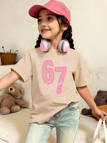 This Girls' Short Sleeve T-Shirt Features A Unique 67 Letter Print Design And A Soft Round Neck Design, Making It A Casual Apricot T-Shirt. - Apricot - View 1