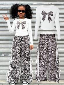 Bộ đồ thể thao 2 mảnh Sparklin Girls họa tiết da báo thoải mái, thời trang, thắt nơ bên hông, gồm quần ống rộng và áo thun dài tay cổ tròn họa tiết nơ, thích hợp cho mùa xuân/đông, phong cách đường phố, đi học, tụ họp, hoạt động ngoài trời, kỳ nghỉ, du lịch và mặc hàng ngày. - trắng - Xem 1