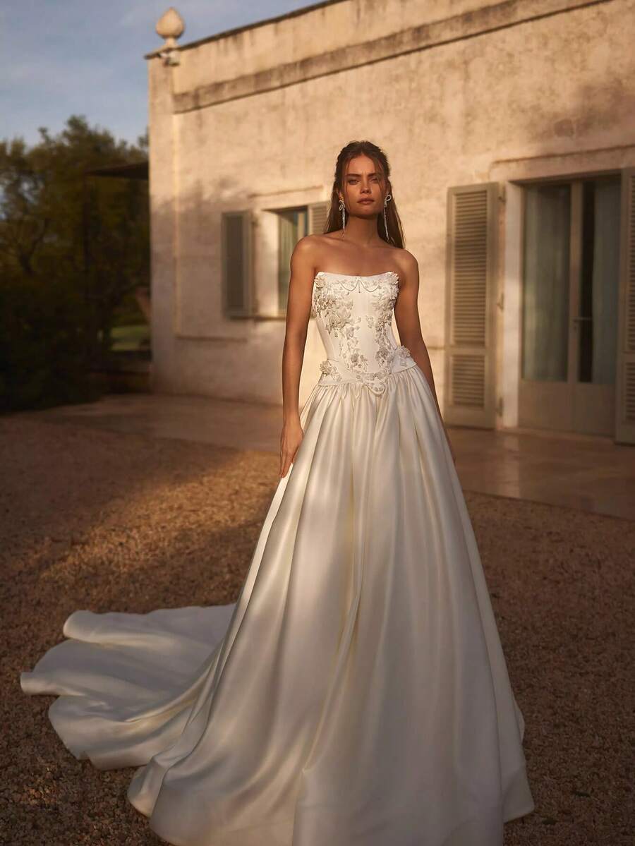 Strapless A-Line Satin Wedding Dress For Women - Fitted Corset Bodice With Boning, Floor-Length Bridal Gown With Long Flowing Train, 3D Beaded Lace And Sparkling Rhinestones, Open Back With Adjustable Lace-Up Design, Elegant Feminine Silhouette Highlighting Waist And Curves, Minimalist Modern Meets Vintage Royalty Style, Smooth Matte Satin With Structured Flow, Glamorous Bridal Gown Perfect For Castle Weddings, Church Ceremonies, Grand Banquets, Evening Parties, Proms, Special Celebrations, Confident Bride Look - trắng - Xem 1