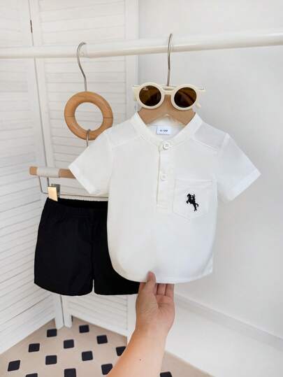 2pcs Baby Boys' Casual Simple White Short Sleeve Shirt With Chest Pocket Embroidery Decor, Paired With Black Shorts Set, Suitable For Street, School, And Daily Wear