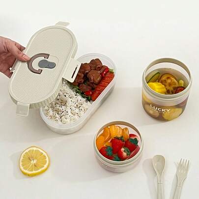 透明塑料椭圆形午餐盒，配有折叠叉勺，可重复使用，密封防漏，便携大容量，耐冷耐热，可存放水果沙拉等食物，适用于冰箱和微波炉，适合学生和成人在学校、办公室、户外露营、野餐、旅行、返校等场合使用。