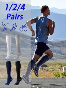 男女通用压缩袜，1/2/4 双装，采用尼龙涤纶混纺针织面料，贴合腿部曲线，为瑜伽、马拉松、滑雪、网球、足球、健身、篮球等运动提供支撑，可机洗。 - 彩色 - 查看 1