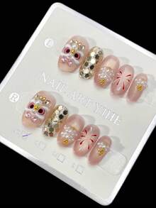 10 قطع ملصقات أظافر بيضاوية قصيرة يدوية الصنع، مناسبة للحفلات والاستخدام اليومي، لون شمبانيا وألوان اللؤلؤ والنار الاصطناعية، بشكل بيضاوي قصير، سهلة الارتداء. 10 قطع ملصقات أظافر يدوية من طراز Y2K، مناسبة للفتيات والنساء لارتدائها في حفلات العطلات والمناسبات اليومية. مستلزمات الأظافر - لون شمبانيي - مشاهدة 2