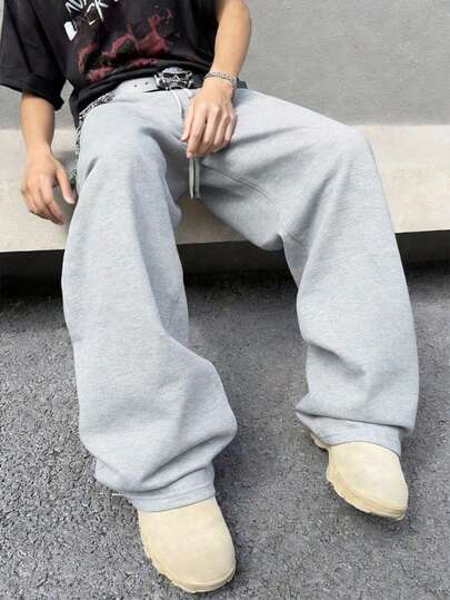 男士宽松休闲运动裤，采用简约纯色阔腿设计，抽绳腰带，大口袋，适合日常散步、工作、旅行等各种场合。这款轻盈的阔腿休闲裤采用 100% 涤纶面料，四季皆宜。如果您需要加厚款，请访问我们的店铺。