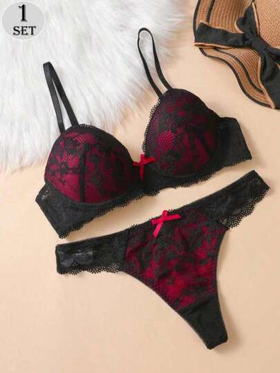 2pcs/Set Black Lightweight Floral Lace Wireless Bra And Panty Set. Features Include Delicate Bow Accents, Sexy Lace Patterns, Color Contrast, Adjustable Straps, And A Comfortable Yet Supportive Bra And Thong Set.