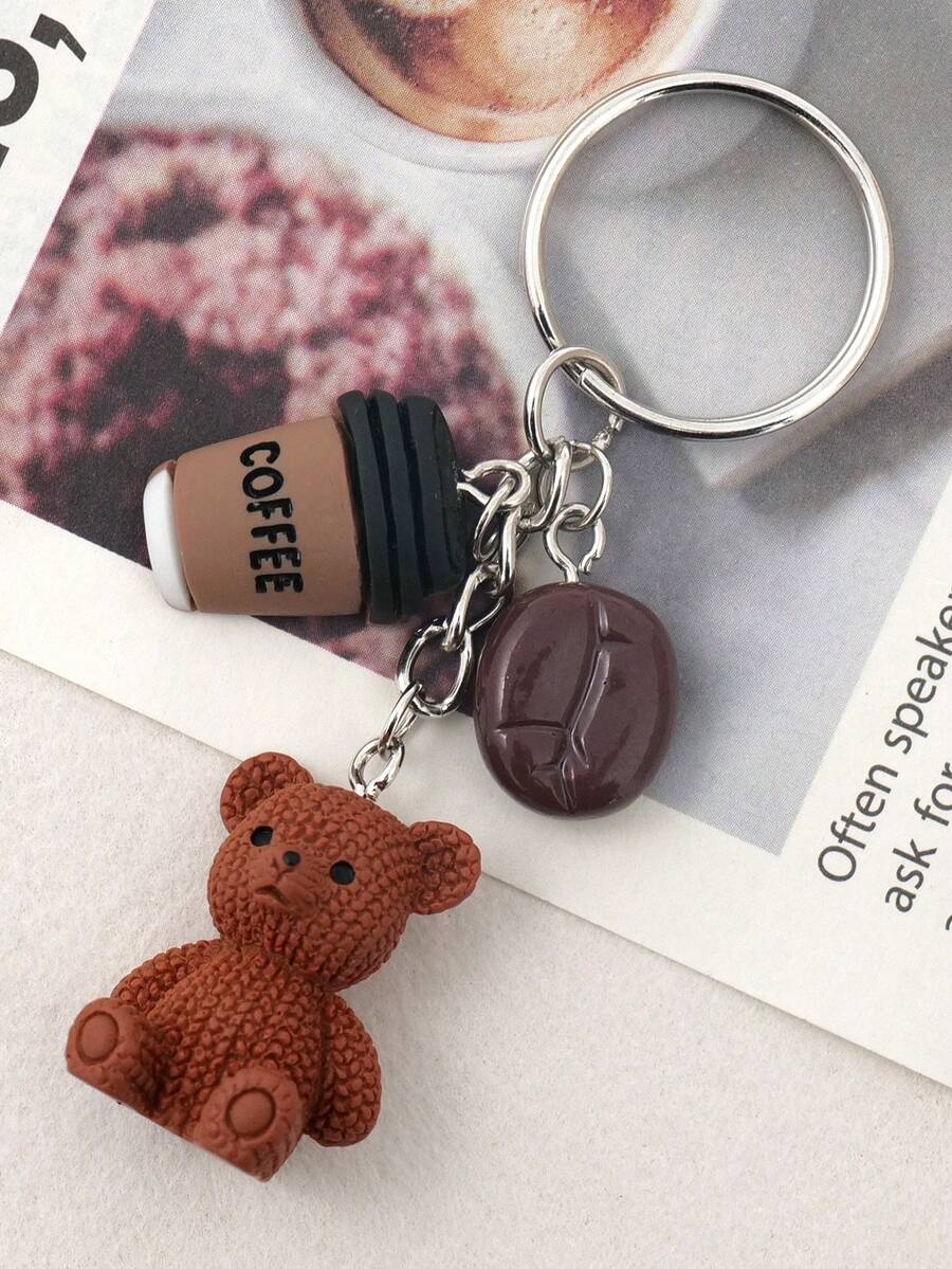 1 Móc khóa hình gấu bông nâu dễ thương - Hình gấu bằng nhựa, hạt cà phê, cốc cà phê với vòng kim loại - Quà tặng sinh nhật, quà tặng cho người yêu cà phê, quà tặng tiệc tùng, trang trí ví và sổ tay - Phụ kiện thời trang cho nữ, thiết kế ngộ nghĩnh, vòng kim loại bền chắc, có thể dùng làm phụ kiện túi xách, quà tặng cho xe hơi, giáo viên, bạn bè, chị em gái, quà tặng cho mẹ, bố, quà tốt nghiệp và quà cho giáo viên.