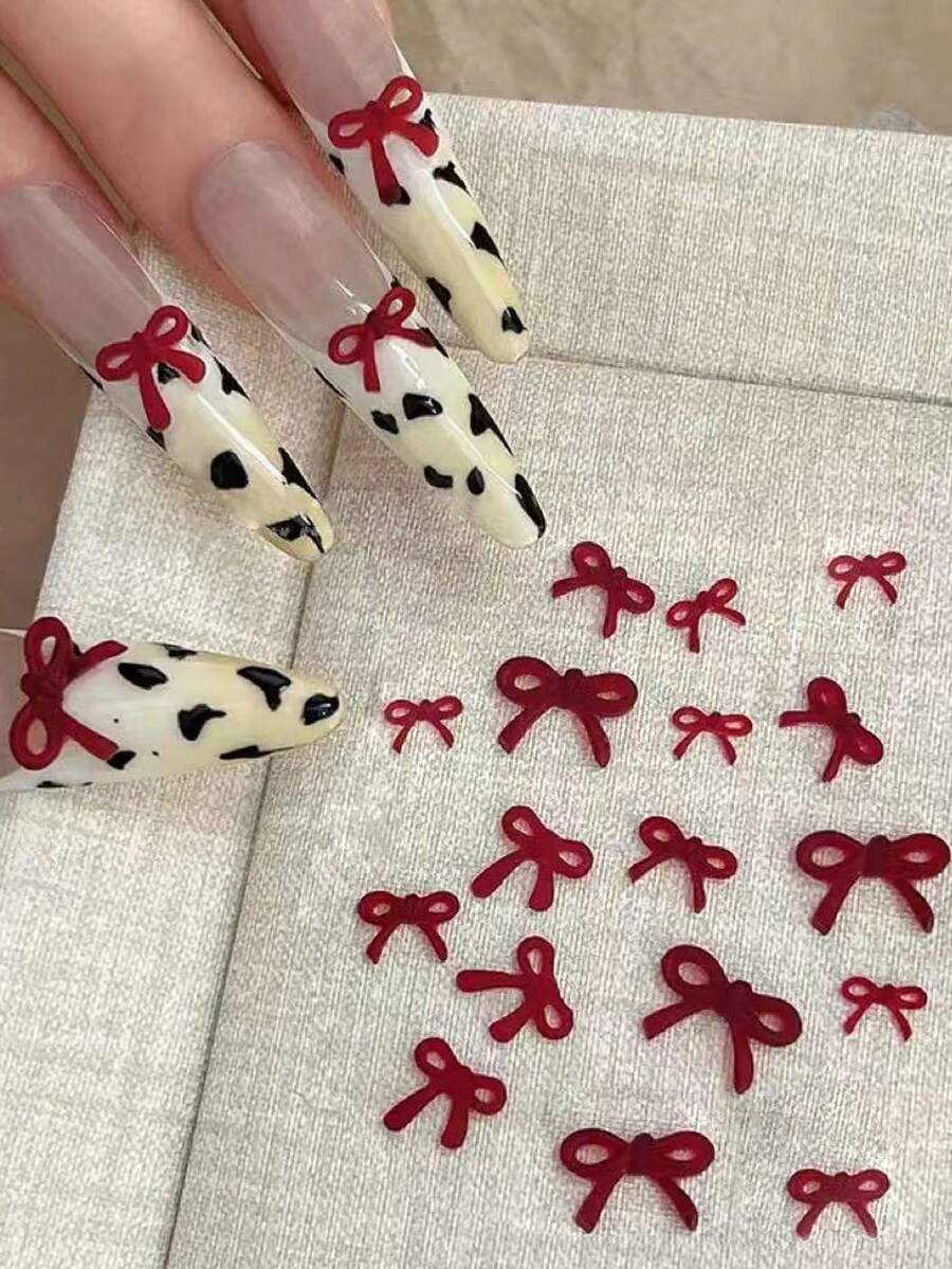 50件套酒红色蝴蝶结美甲装饰套装，3D立体造型，尺寸多样，适合在哑光、亮光、长指甲、杏仁形指甲、短指甲和法式美甲上打造可爱美甲造型。 - 彩色 - 查看 1