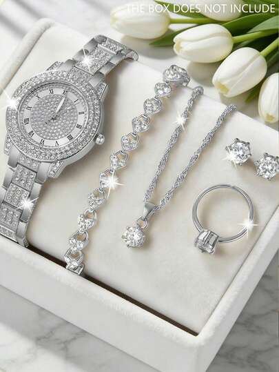 6 Parçalı Lüks Kadın Kuvars Saat ve Takı Seti (1 Adet Elmas İşlemeli Kadranlı ve Romen Rakamlı Gümüş Metal Saat, 1 Adet Elmas İşlemeli Kalp Bileklik, 1 Adet Elmas İşlemeli Kolye, 1 Adet Elmas İşlemeli Küpe ve 1 Adet Elmas İşlemeli Yüzük İçerir)
