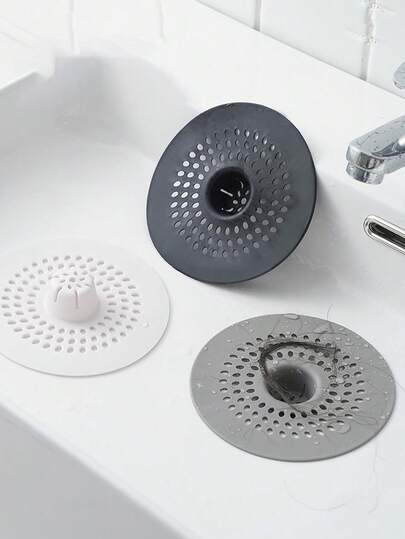 1 pièce Bandes filtrantes de drain en silicone spécialement conçues pour les zones de douche et les éviers de cuisine. Le filet de filtre de sol "Hair Buster" peut facilement intercepter les cheveux et les débris, éliminant ainsi les obstructions ! Ce dispositif anti-blocage de drain de sol facilite le nettoyage d'un simple soulèvement et d'un jet, éliminant la nécessité d'atteindre le drain !