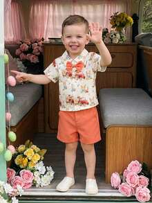 Conjunto de 2 piezas de Pascua para niños, con estampado de huevos de conejito de verano, top de manga corta con cuello vuelto y pantalones cortos - Naranja - Ver 1