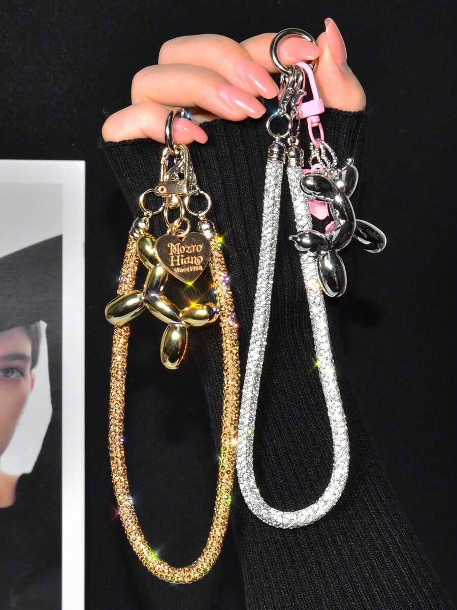 一套奢华小众设计水钻手机防丢腕带，精致时尚全水钻手提短挂链，果冻气球狗手机情侣吊坠，高端创意可爱包包钥匙扣挂件