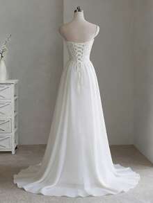 Glamorous Strapless A-Line Wedding Dress With Open Back In Chiffon – Sophisticated Floor-Length Bridal Gown Featuring A Flattering Corset Bustier, Daring Backless Design, And Flowing Chiffon Silhouette, Perfect For Weddings, Christmas Galas, Halloween Balls, Formal Dances, Birthday Celebrations, And Special Evening Events. A Versatile Choice For Wedding Receptions, Holiday Parties, Anniversary Dinners, Resort Getaways, Black-Tie Occasions, Cocktail Gatherings, Bridal Showers, Wedding Guest Attire, Graduation Formals, Homecoming Events, And As A Modern Bridesmaid Or Festive Evening Gown. - trắng - Xem 2