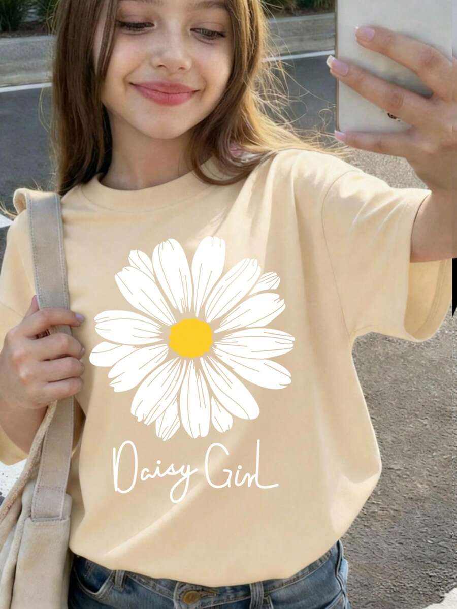 这款女童短袖T恤采用鲜艳的雏菊印花设计,搭配柔软舒适的圆领,是一款清爽舒适的夏季上衣,可机洗。 - 杏色 - 查看 1