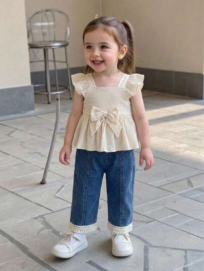 Fashionable Retro Baby Girl Bow Decor Textured Fabric Camisole Top And Stylish Denim Lace Trim Pants Set, Comfortable