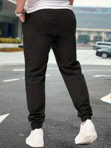 Shendy Vendy Pantalones Jogger Con Puños Y Cintura Elástica Con Cordón Y Bolsillos Inclinados Sueltos Para Hombre - Blanco y Negro - Ver 4