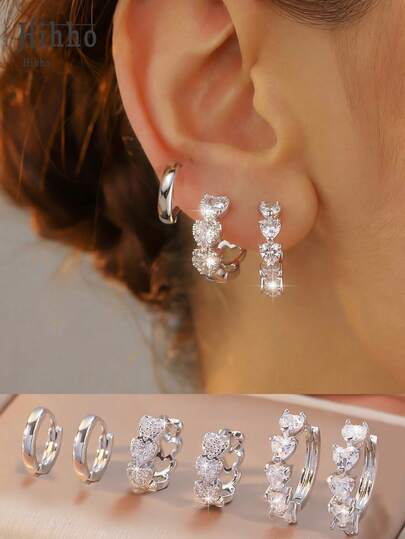 Hihho 6件套银色心形锆石耳环套装，甜美活力奢华风，银色底，包含素圈耳环、心形耳环和多层心形吊坠组合，甜美青春的心形设计，闪耀镶嵌，兼具少女魅力与高端品质，适合叠戴，日常通勤、约会、送礼皆宜。