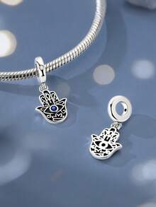 Silver Chams Hamsa Hand Evil Eye Pendant Cut-Out Pattern Showcasing The Classic Hand Shape Blue Cubic Zirconia Stone In The Center - Silver - View 1