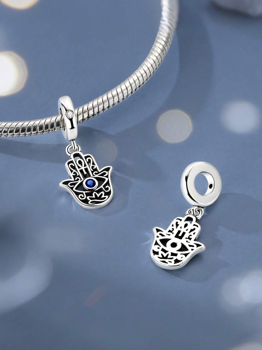 Silver Chams Hamsa Hand Evil Eye Pendant Cut-Out Pattern Showcasing The Classic Hand Shape Blue Cubic Zirconia Stone In The Center - Silver - View 1