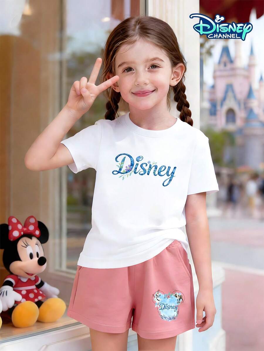 This Disney Frozen Collaboration T-Shirt And Shorts Set For Girls Aged 4-12 Features A White Crew Neck Short-Sleeved Top With A Watercolor Floral "Disney" Logo On The Front And A Combination Of Elsa, Princess Anna, Olaf, And Sven On The Back. The Prints Are Clear And Fade-Resistant. It Comes With Pink Elastic-Waisted Shorts Featuring A Combination Print Of Frozen Characters And Mickey Mouse Head Frames On The Sides. The Shorts Are Soft, Skin-Friendly, Breathable, And Washable. This Two-Piece Set Offers Effortless Style And Is Suitable For Everyday Wear To School, Weekend Outings, Casual Relaxation At Home, And Outdoor Play, Meeting Children's Diverse Dressing Needs. It's An Excellent Choice For Mothers Looking For A Stylish Outfit For Their Daughters. - White Top + Pink Shorts - View 1