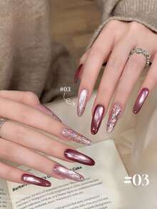 2026春夏新款女士节日礼盒套装，容量12毫升：紫色葡萄泡泡、浅裸粉色、红宝石水晶猫眼、裸色透明、金色粉日记、酒红色乳玉猫眼、玻璃珠水晶猫眼甲油胶。适合四季美甲，搭配底油和亮油使用，需配合UV灯固化。 - 彩色 - 查看 21