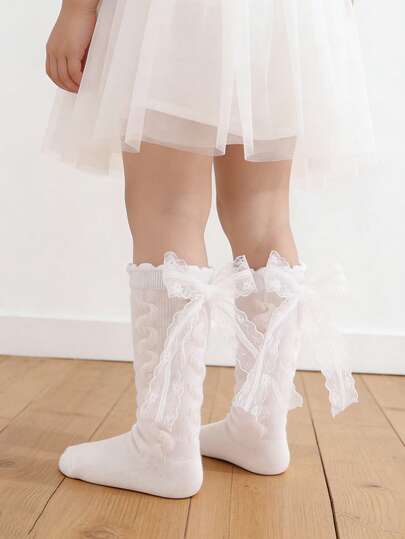 1双女婴蝴蝶结装饰甜美可爱纯棉中筒袜，四季皆宜，适合返校和日常穿着