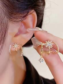 A Luxurious Golden Toned Star Shaped Synthesis Zirconia Shaped Earring, A Fashionable And Dynamic Choice, With A Strong Atmosphere That Can Be Carried On A Daily Basis And At Parties. It Is The Perfect Gift And Exquisite Jewelry - Gold - View 1
