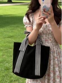 1件極簡時尚手提包，純色中性女款托特包，獨特蝴蝶結設計帆布包，日系休閒對比色學生包，中性手提收納購物袋，適合學生、媽媽購物與旅行，可裝便當盒、日常必需品，中性款 - 黑色 - 查看 9