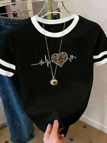 Camiseta de verano holgada para mujer de estilo retro, con estampado de línea de latido geométrica y corazón de leopardo, diseñada con colores contrastantes y cuello redondo - Negro - Ver 4