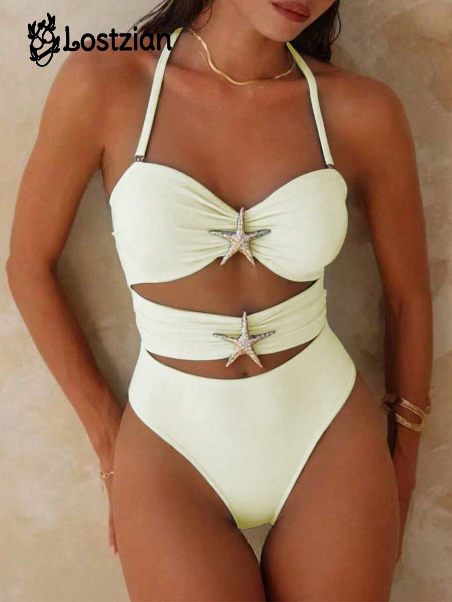 女士夏季套装，米色连体泳衣，采用舒适高弹尼龙面料，带胸垫和内衬，时尚小海星装饰，露背挂脖设计，米色女士连体泳衣，沙滩度假套装