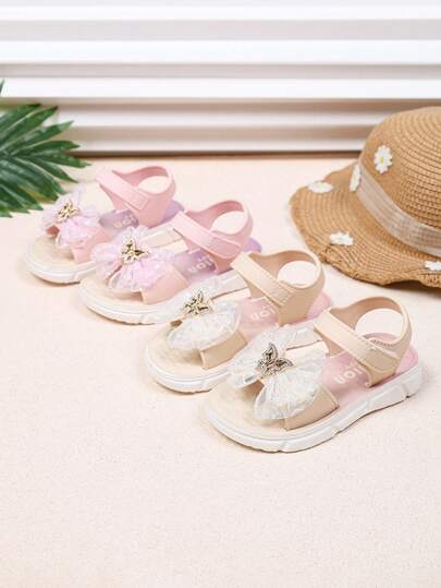 1双春夏新款婴儿凉鞋，蝴蝶结绑带设计，时尚舒适软底女童运动凉鞋，PU魔术贴设计户外平底凉鞋，适合女童和宝宝夏季沙滩及室内外穿着